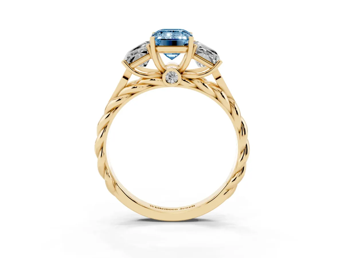 Fancy Blue Three-Stone Emerald Cut Diamond Braided Band Ring with Four-Prong Setting Yellow gold
