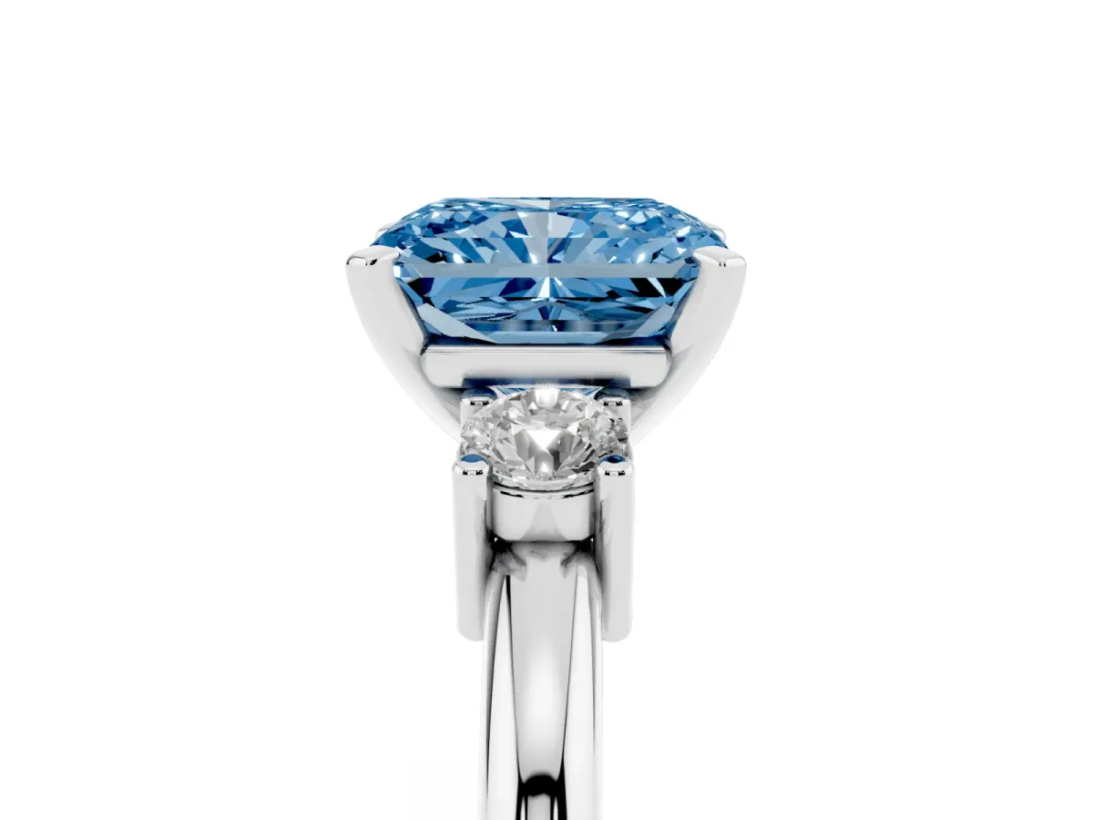 Fancy Blue Three-Stone Radiant Cut Cut Diamond Solitaire with Prong Setting and Classic Band Platinum