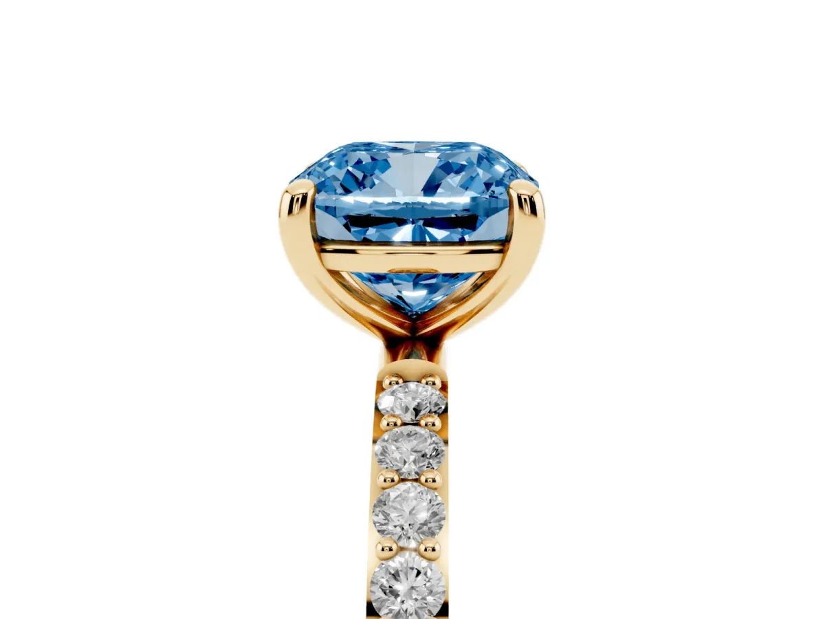 Fancy Blue Cushion Cut Diamond Solitaire Ring with Round Pavé Band and Prong Setting Yellow gold