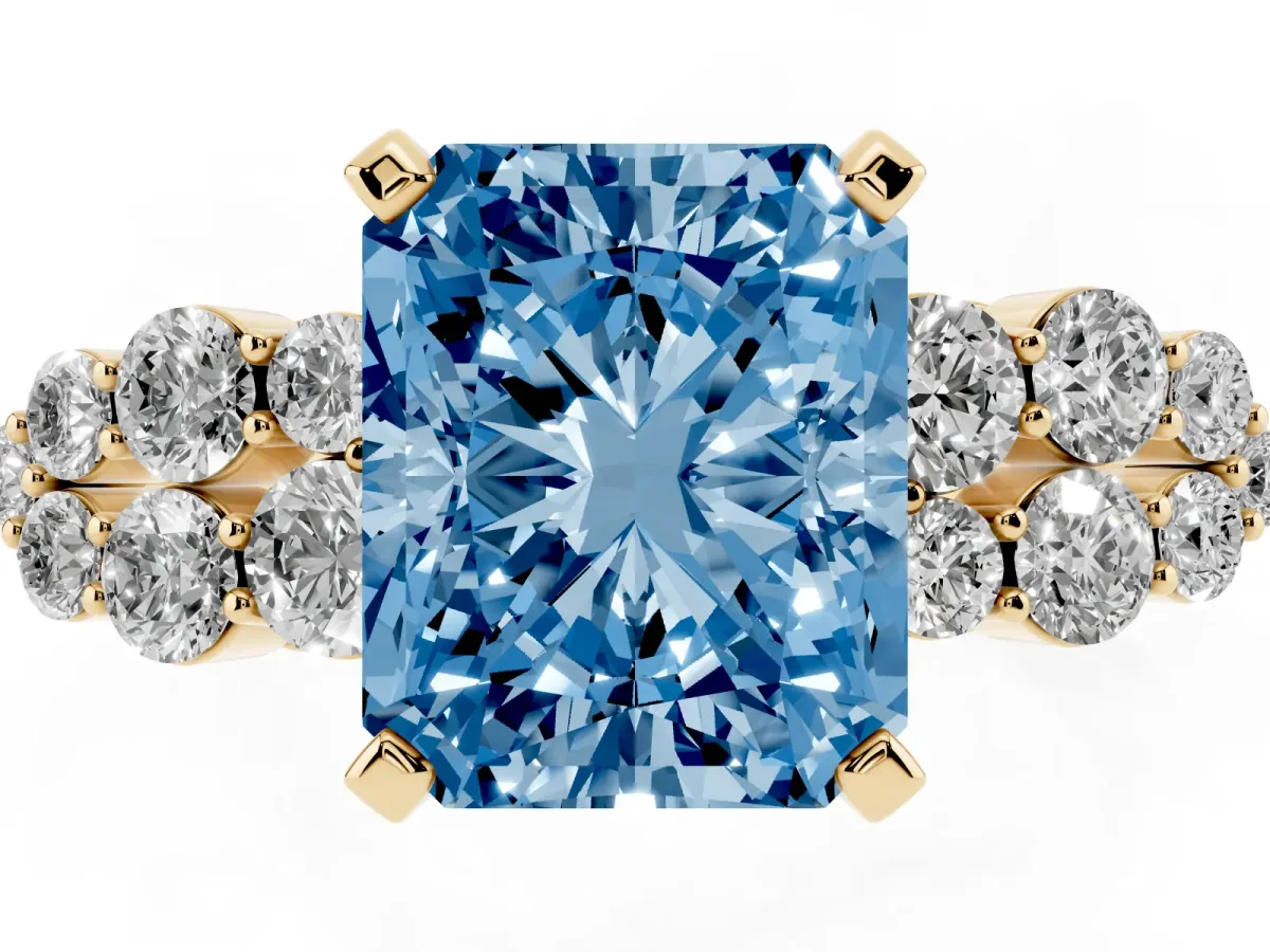 Fancy Blue Radiant Cut Cluster Diamond Engagement Ring with Pavé Band and Four-Prong Setting Yellow gold