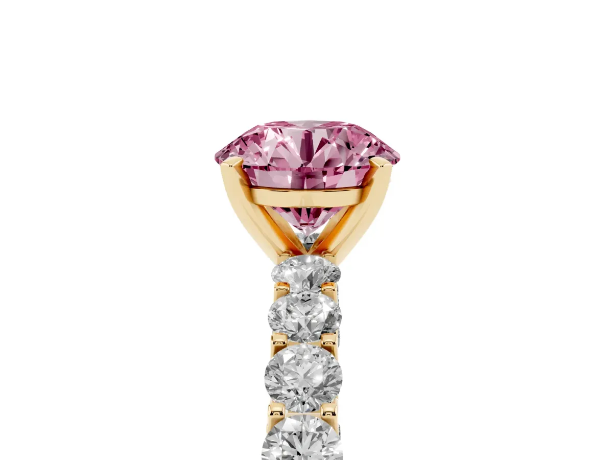 Fancy Pink Round Cut Diamond Solitaire Ring with Shared Prong Pavé Band and Four-Prong Setting Yellow gold