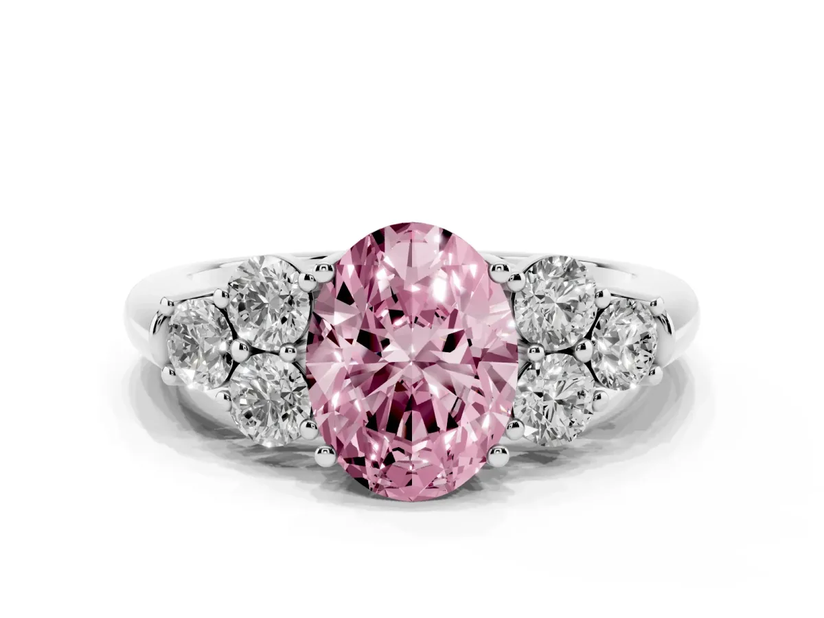 Fancy Pink Oval Cut Cut Diamond Cluster Ring with Round Accent Stones and Prong Setting on a Classic Band Platinum