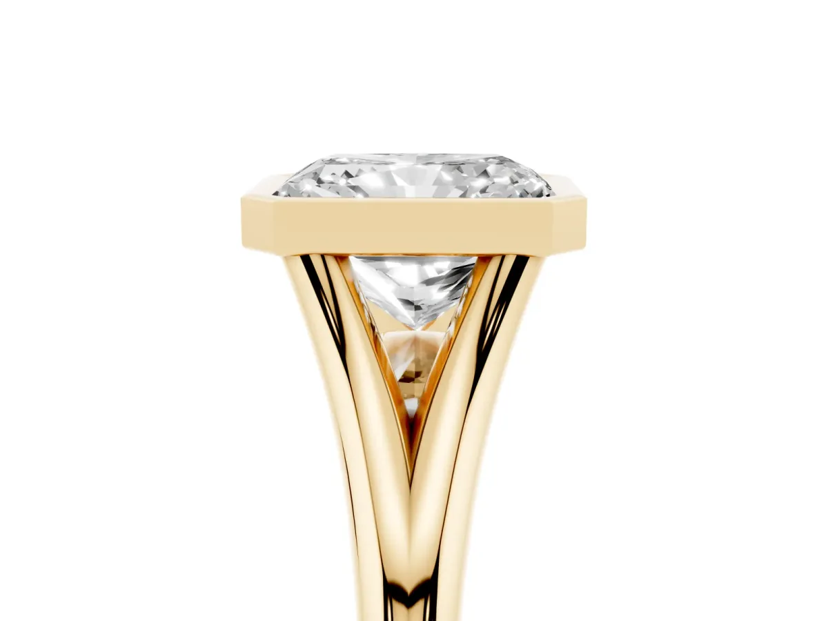 Bezel Set Radiant Cut Cut Solitaire Ring with Tapered Band Yellow gold