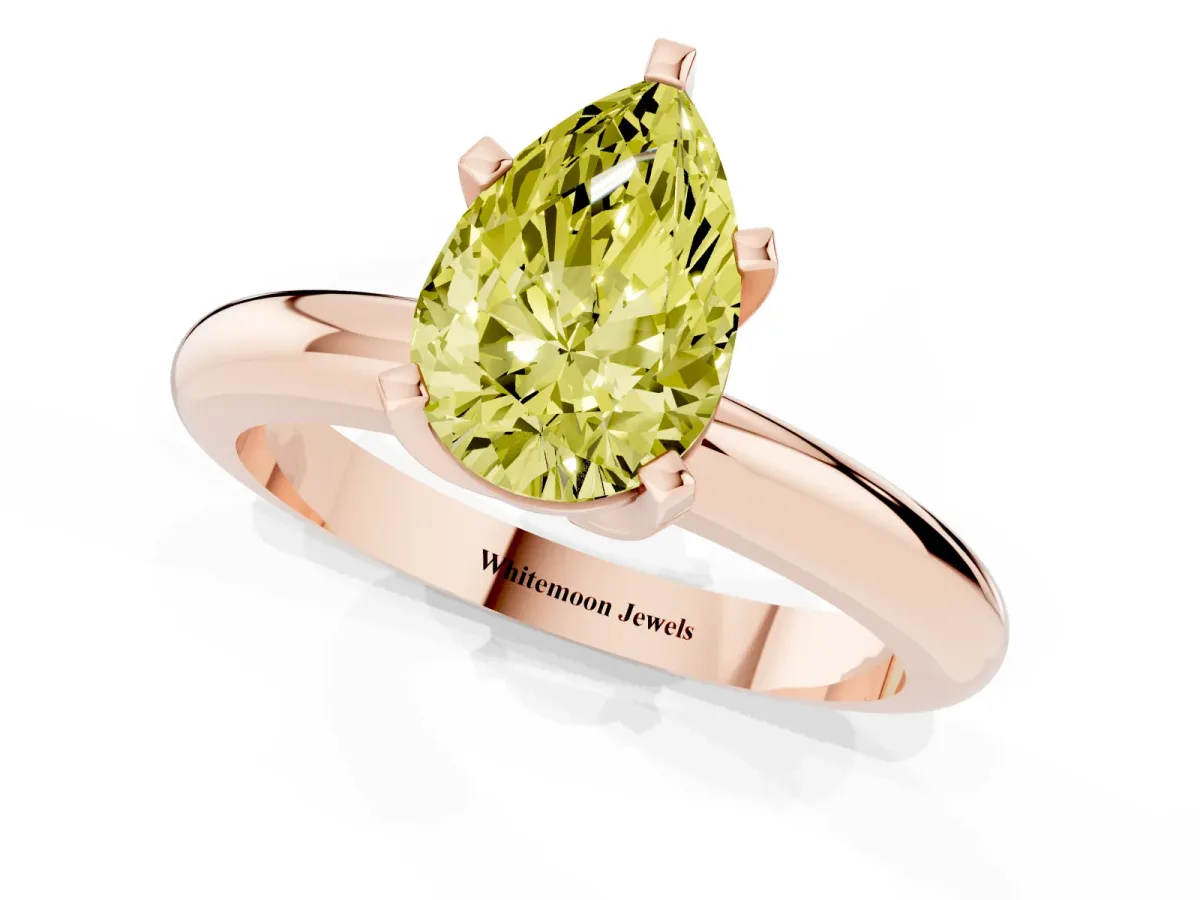 Fancy Yellow Pear Cut Diamond Solitaire Engagement Ring with Round Band and Four-Prong Setting Rose gold