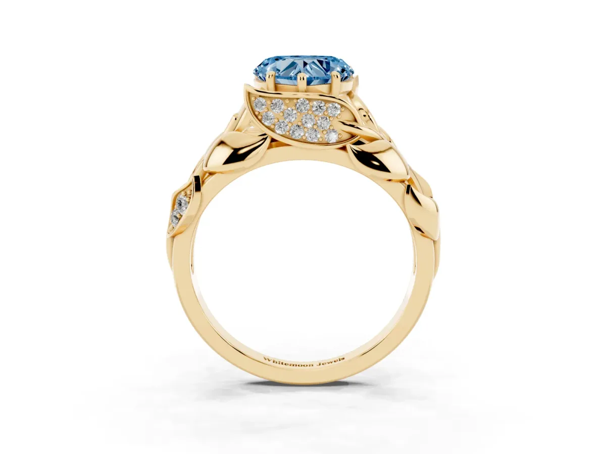 Fancy Blue Heart Cut Diamond Leaf-Inspired Engagement Ring with Round Accents and Prong Setting Yellow gold