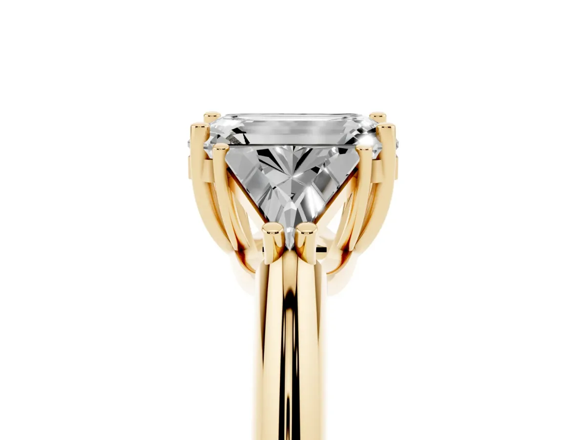 Three-Stone Emerald Cut Diamond Engagement Ring with Trillion Side Stones and Prong Setting Yellow gold