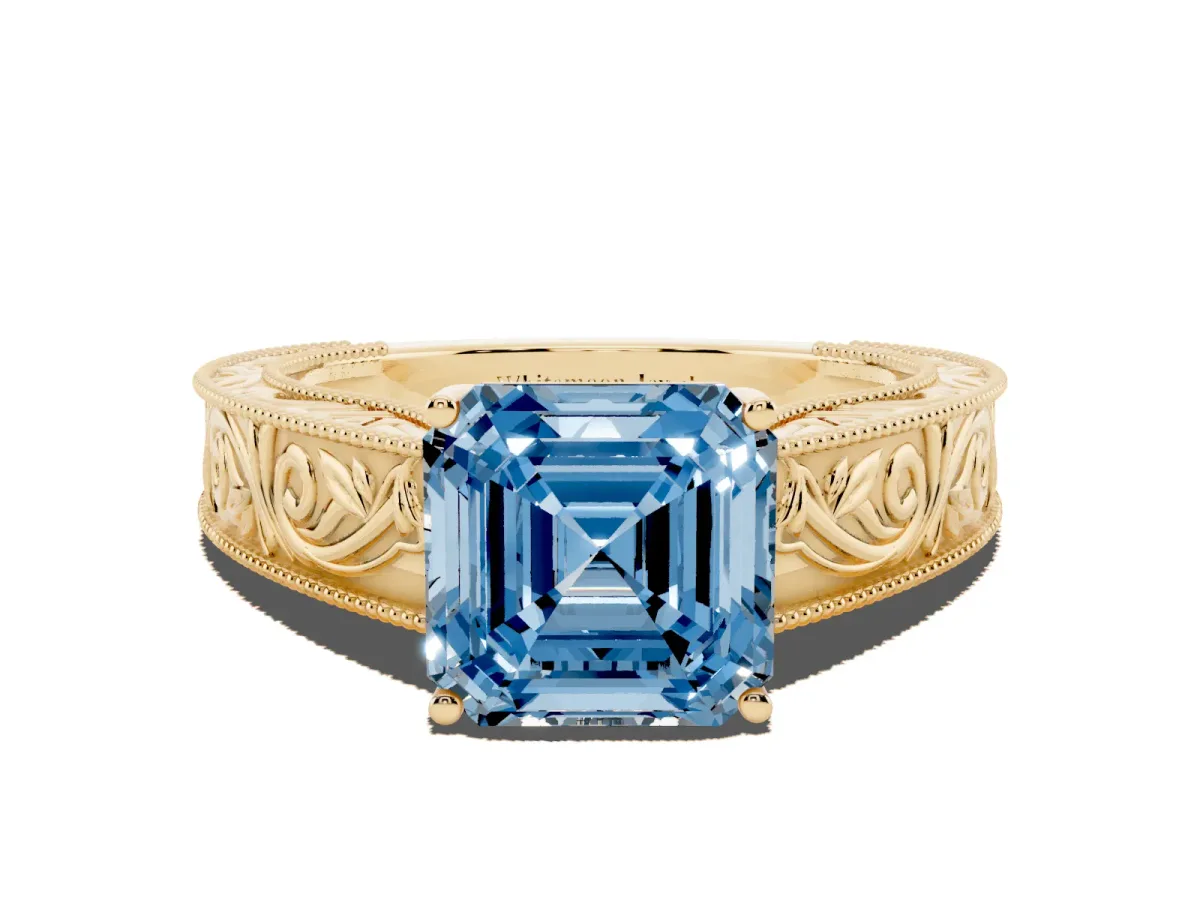 Fancy Blue Asscher Cut Diamond Solitaire Ring with Engraved Band and Four-Prong Setting Yellow gold
