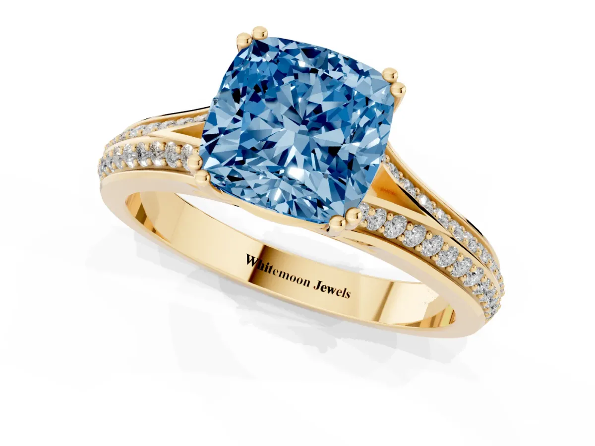 Fancy Blue Cushion Cut Diamond Split Shank Engagement Ring with Pavé Band Yellow gold