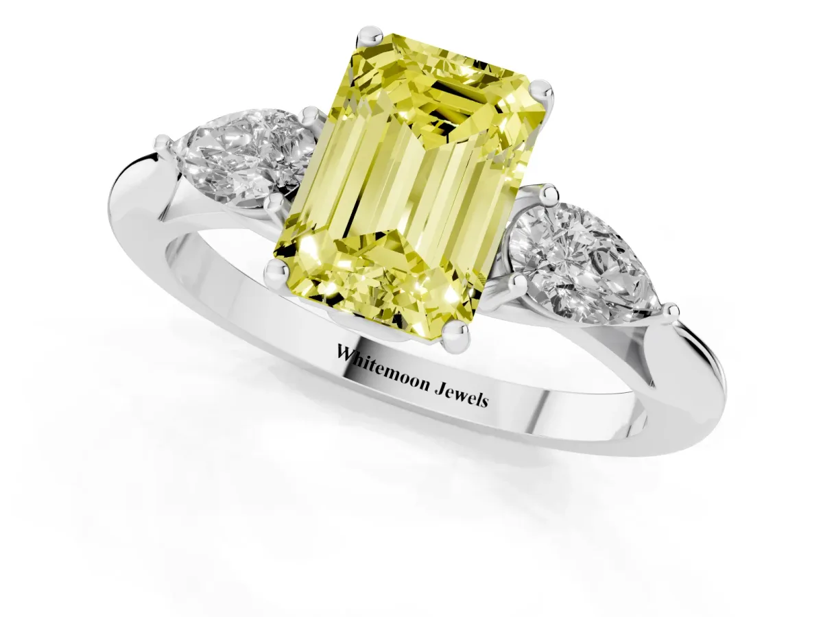 Fancy Yellow Emerald Cut Diamond Three-Stone Ring with Pear Side Stones and Prong Setting Silver