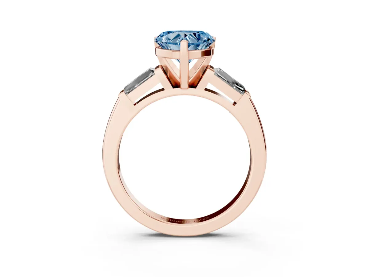 Fancy Blue Heart Cut Solitaire with Tapered Baguette Side Stones on a Classic Band with Four-Prong Setting Rose gold