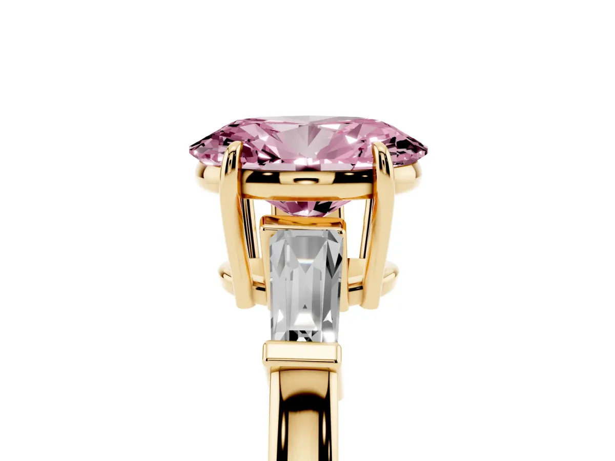 Fancy Pink Oval Cut Diamond Three-Stone Ring with Tapered Baguette Side Stones and Prong Setting Yellow gold