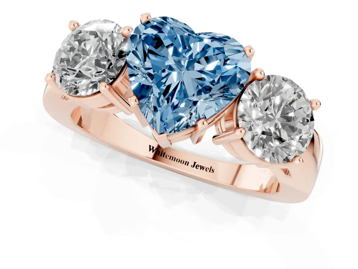 Fancy Blue Three-Stone Heart Cut Diamond Ring with Round Side Stones, Classic Band, and Four-Prong Setting Rose gold