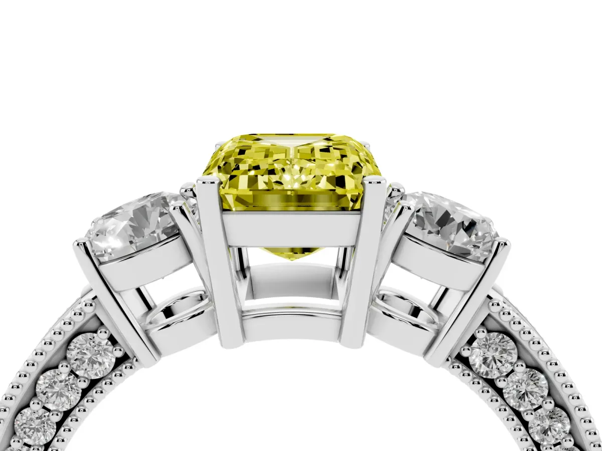 Fancy Yellow Emerald Cut Three-Stone Diamond Ring with Pavé Band and Four-Prong Setting Platinum