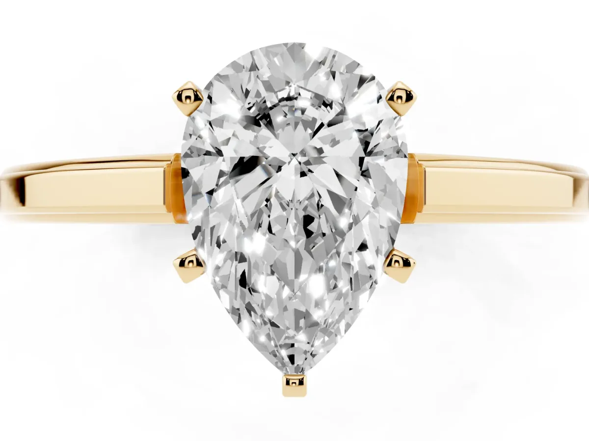 Pear Cut Solitaire Diamond Ring with Four-Prong Setting and Classic Band Yellow gold