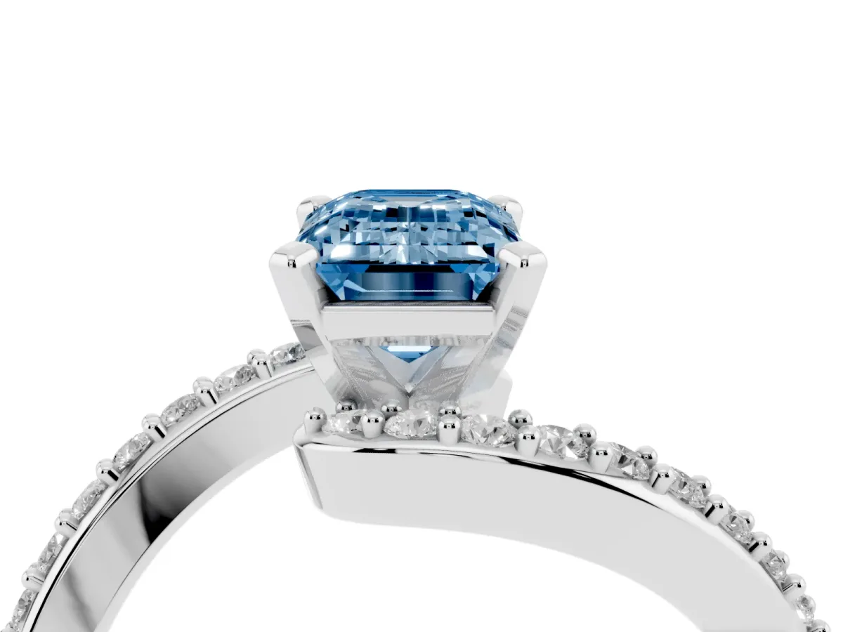 Fancy Blue Emerald Cut Solitaire Twist Band with Pave Set Diamonds and Four-Prong Setting Platinum