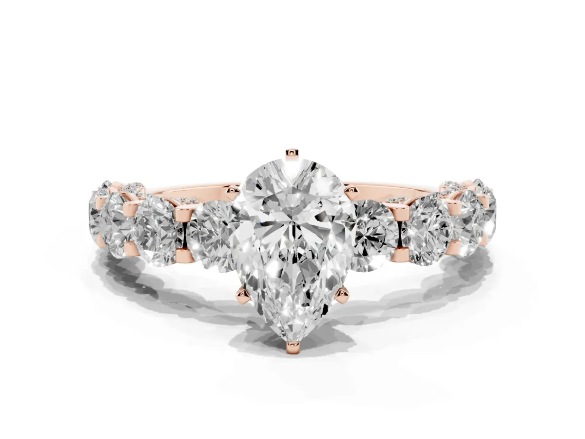 Pear Cut Diamond Side Stone Engagement Ring with Four-Prong Setting Rose gold