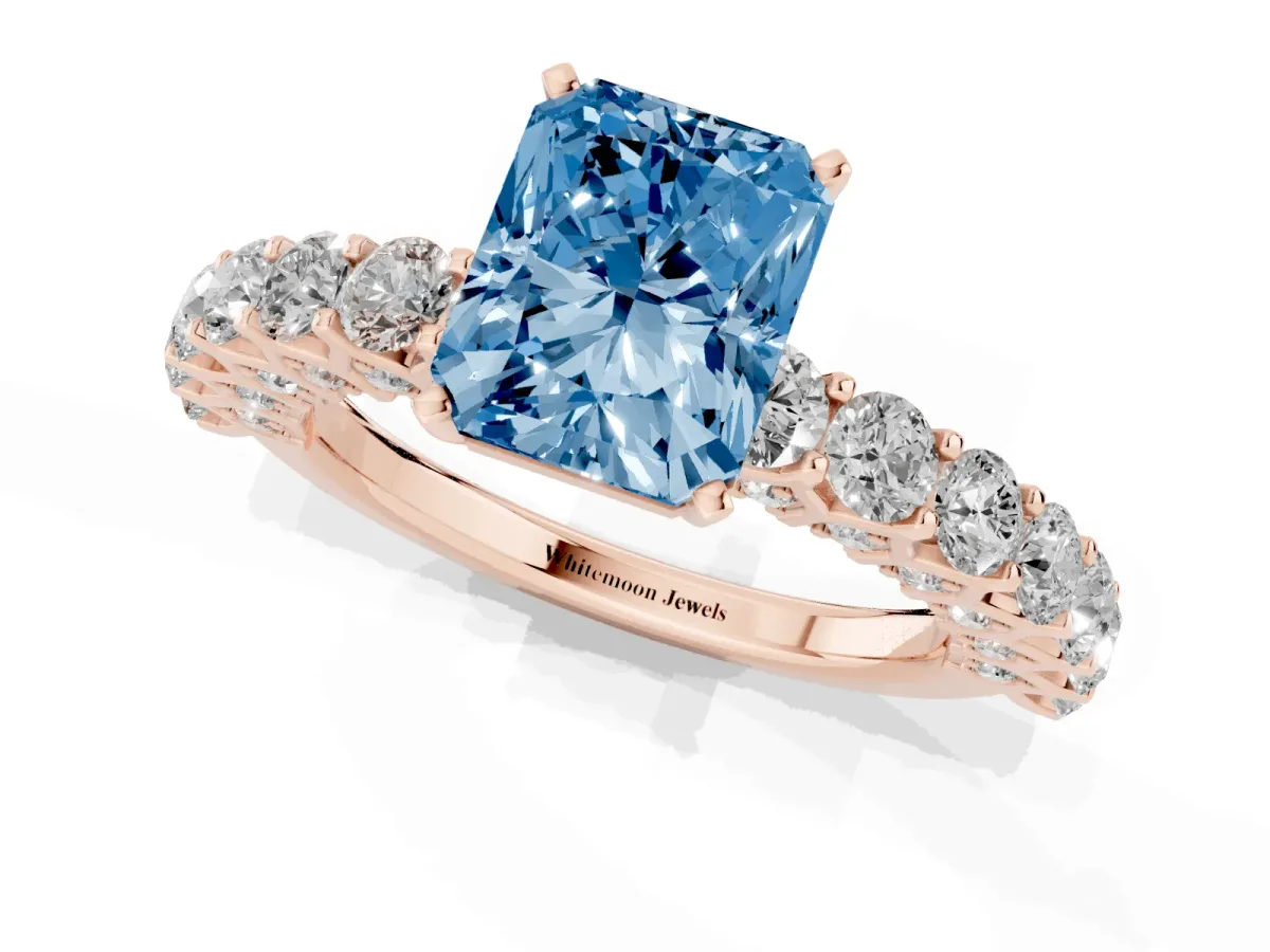 Fancy Blue Radiant Cut Diamond Solitaire Ring with Shared Prong Pavé Band and Four-Prong Setting Rose gold