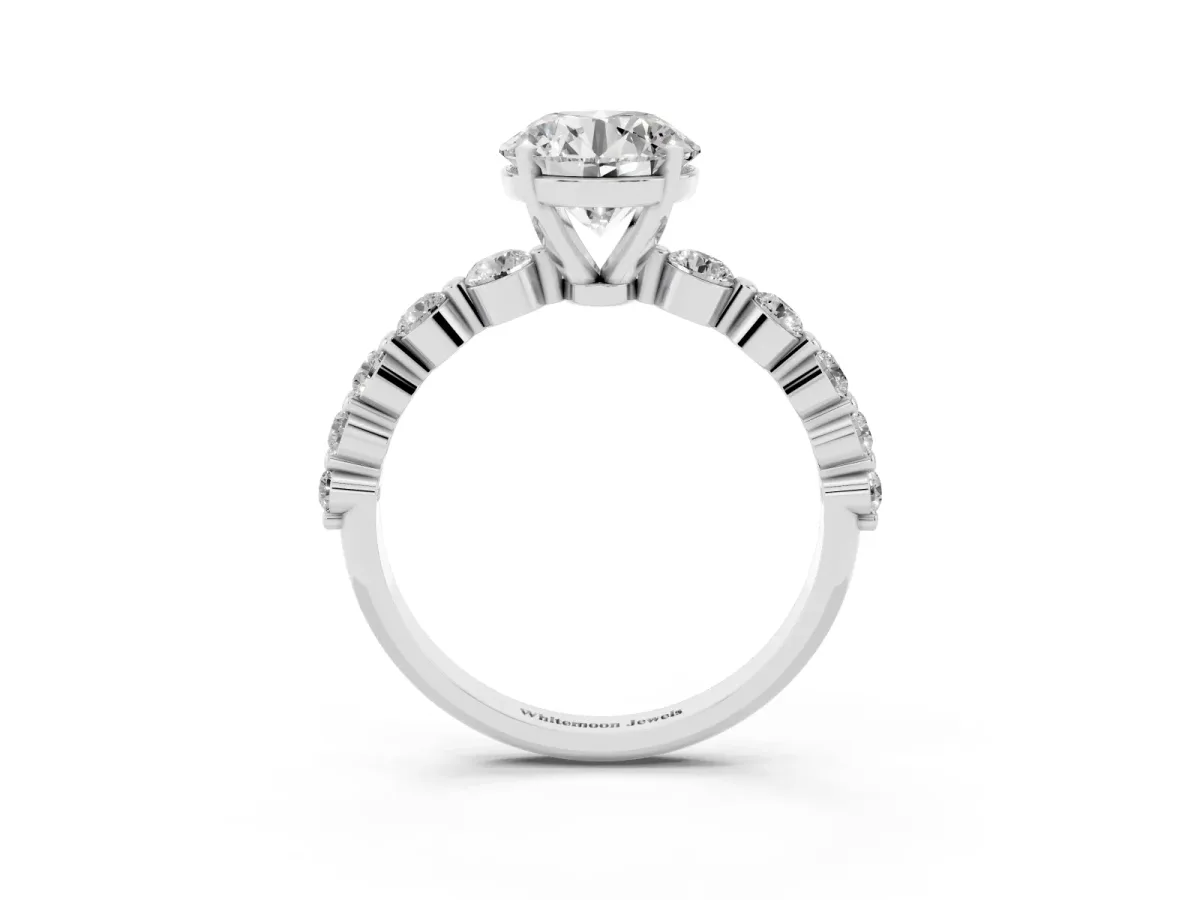 Round Cut Solitaire Diamond Ring with Pave Band and Four-Prong Setting Silver