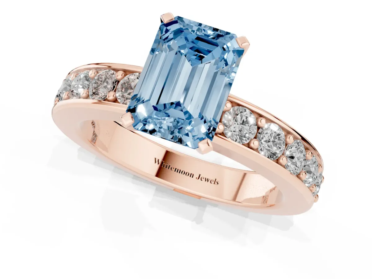 Fancy Blue Emerald Cut Diamond Engagement Ring with Channel Set Round Band and Prong Setting Rose gold