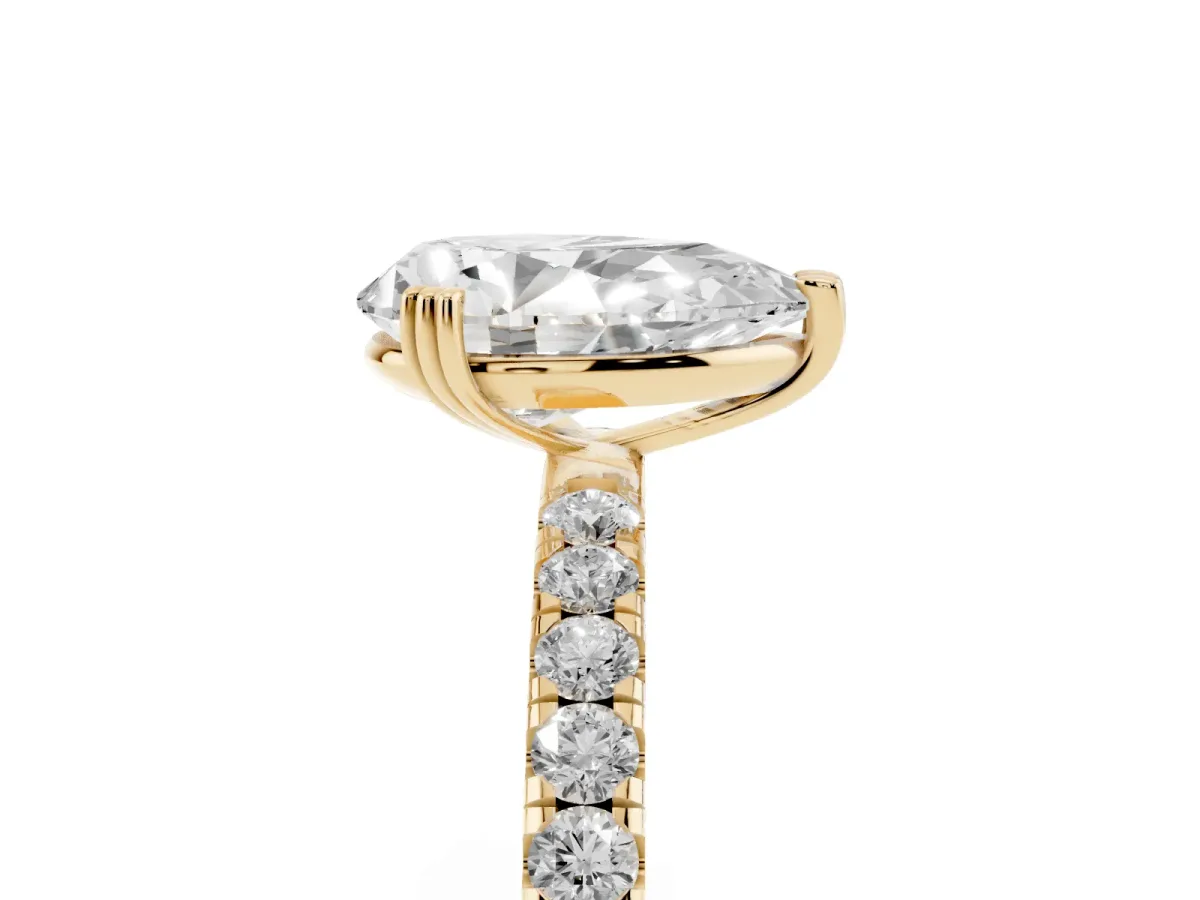 Pear Cut Brilliant Solitaire with Pavé Band and Claw Prong Setting Yellow gold