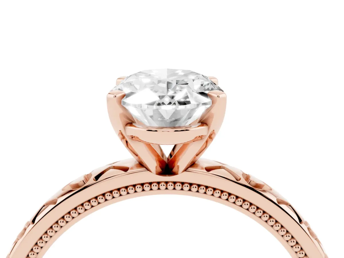 Oval Cut Solitaire Diamond Engagement Ring with XO Engraved Band and Four-Prong Setting Rose gold