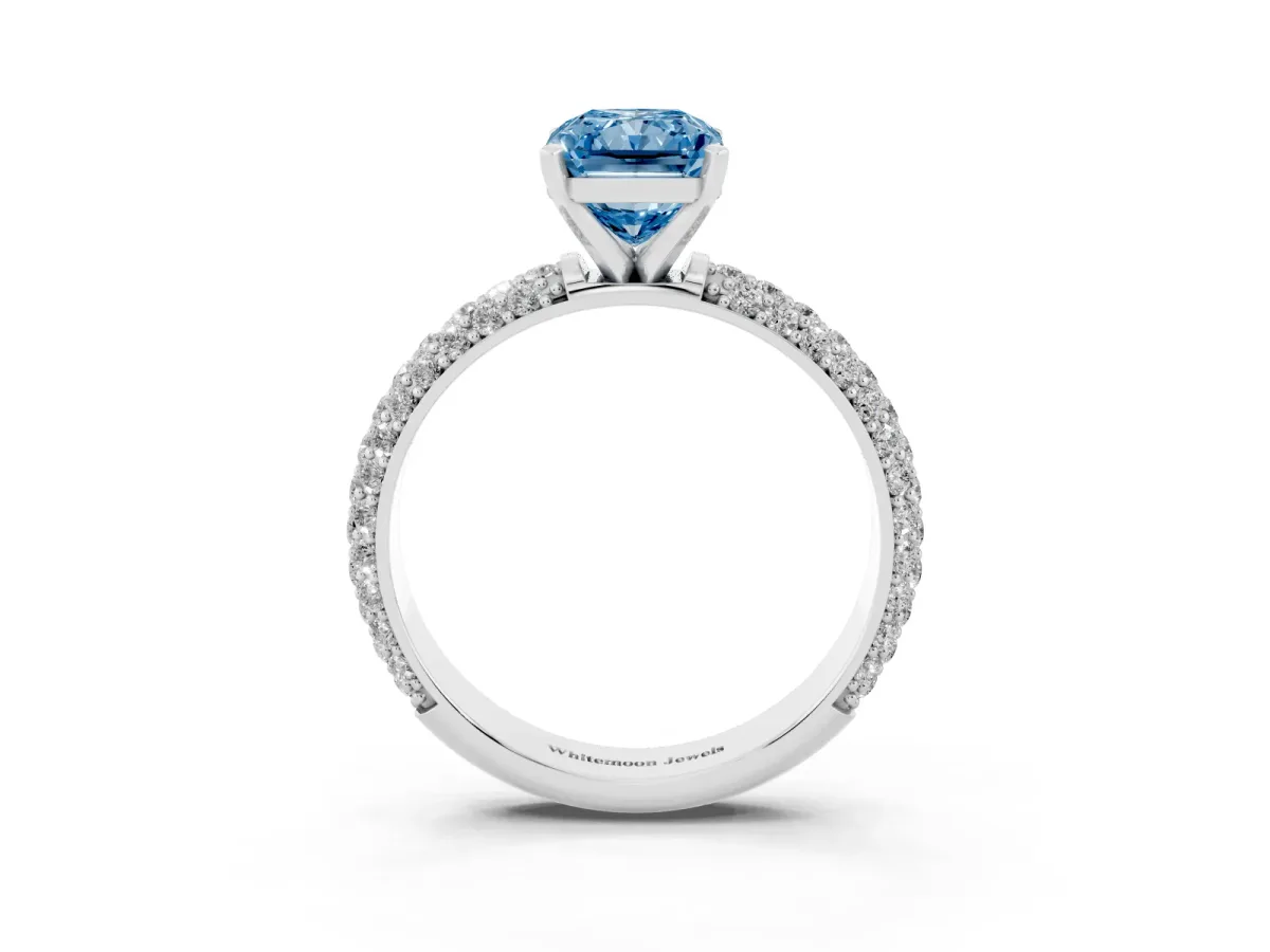 Fancy Blue Radiant Cut Diamond Solitaire Ring with Prong Setting and Pavé Band Silver
