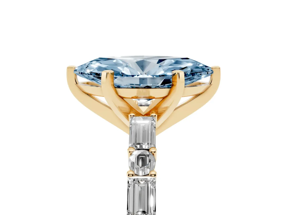 Fancy Blue Marquise Cut Diamond Solitaire with Side Baguettes and Channel Set Band Yellow gold