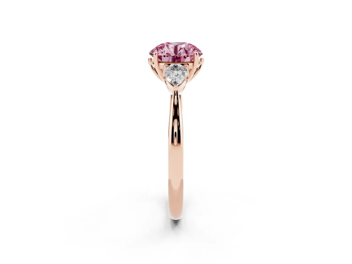 Fancy Pink Three-Stone Round Cut Diamond Ring with Pear Side Stones in Four-Prong Setting Rose gold