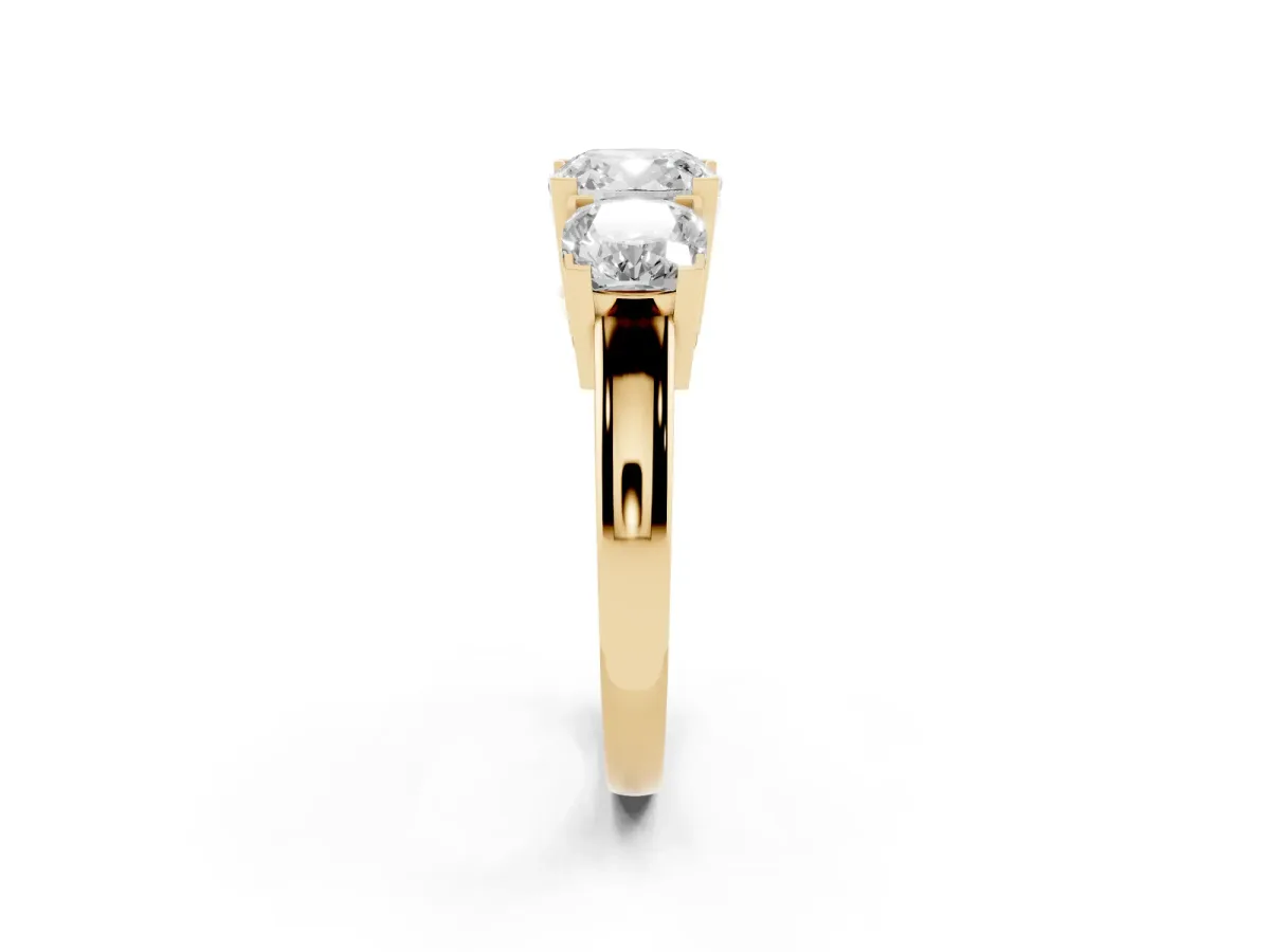 Three-Stone Cushion Cut Cut Diamond Ring with Channel Set Band and Four-Prong Setting Yellow gold