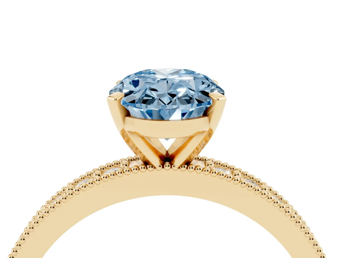 Fancy Blue Oval Cut Diamond Milgrain Pavé Engagement Ring with Four-Prong Setting Yellow gold