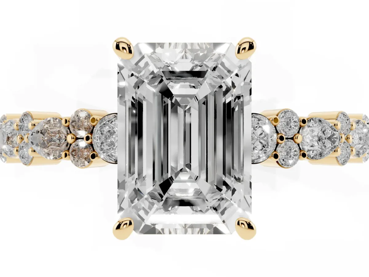 Emerald Cut Diamond Side Stone Solitaire Ring with Round and Four-Prong Setting Yellow gold