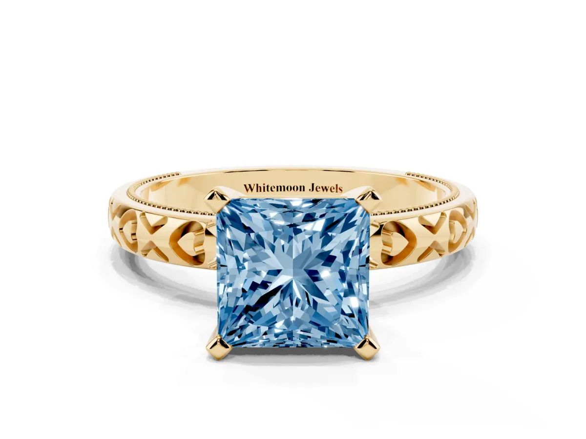 Fancy Blue Princess Cut Solitaire Diamond Engagement Ring with XO Engraved Band and Four-Prong Setting Yellow gold