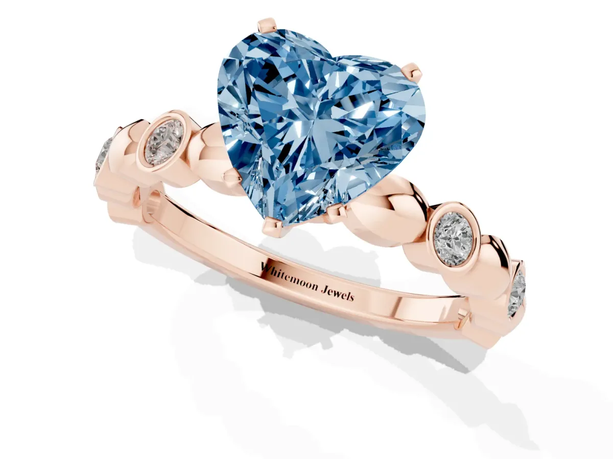 Fancy Blue Heart Cut Solitaire Bezel-Set Diamond Ring with Beaded Band and Four-Prong Setting Rose gold