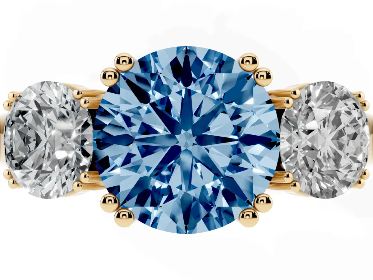 Fancy Blue Three-Stone Round Cut Cut Diamond Ring with Channel Set Band and Four-Prong Setting Yellow gold