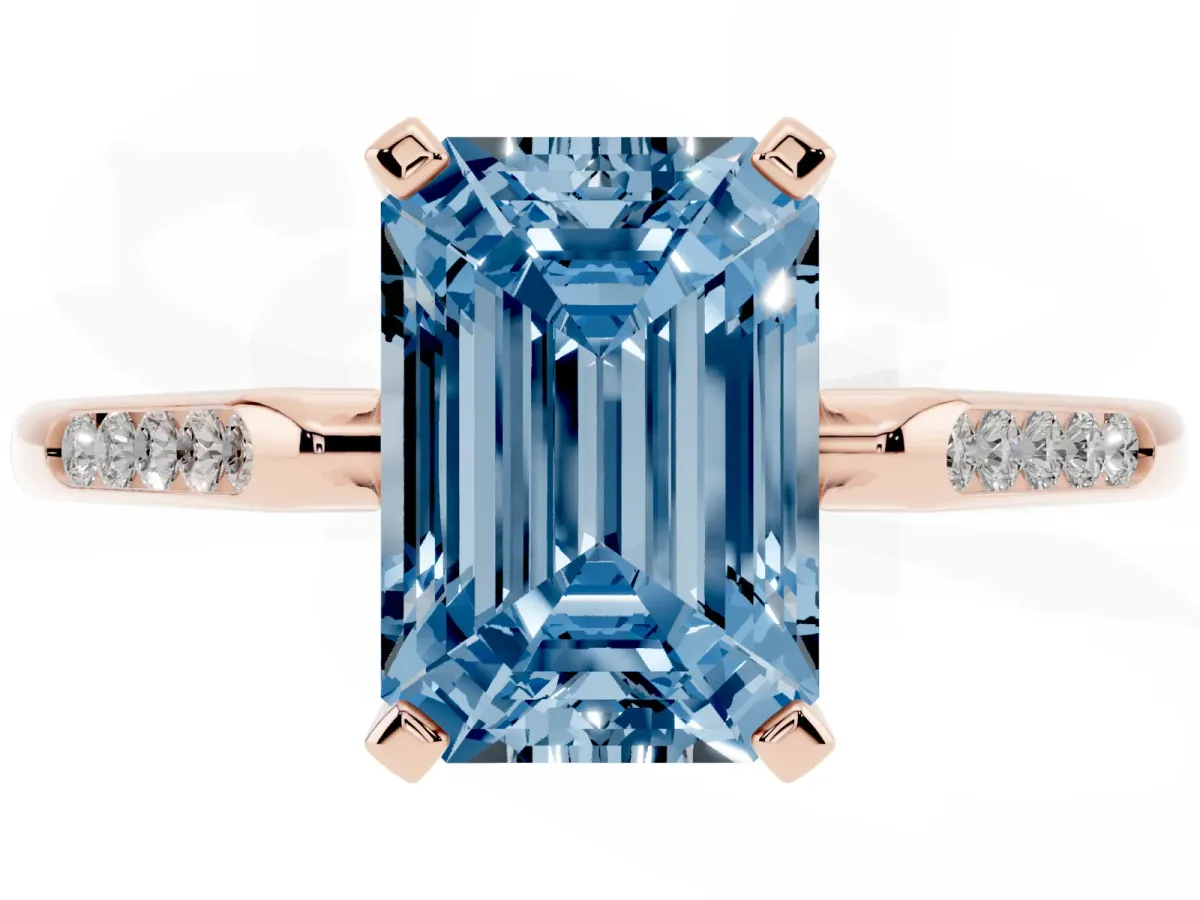 Fancy Blue Emerald Cut Diamond Solitaire Ring with Channel Set Round Band and Prong Setting Rose gold