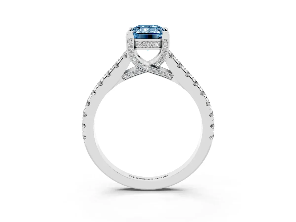 Fancy Blue Emerald Cut Brilliant Diamond Solitaire with Pavé Band and Four-Prong Setting Platinum