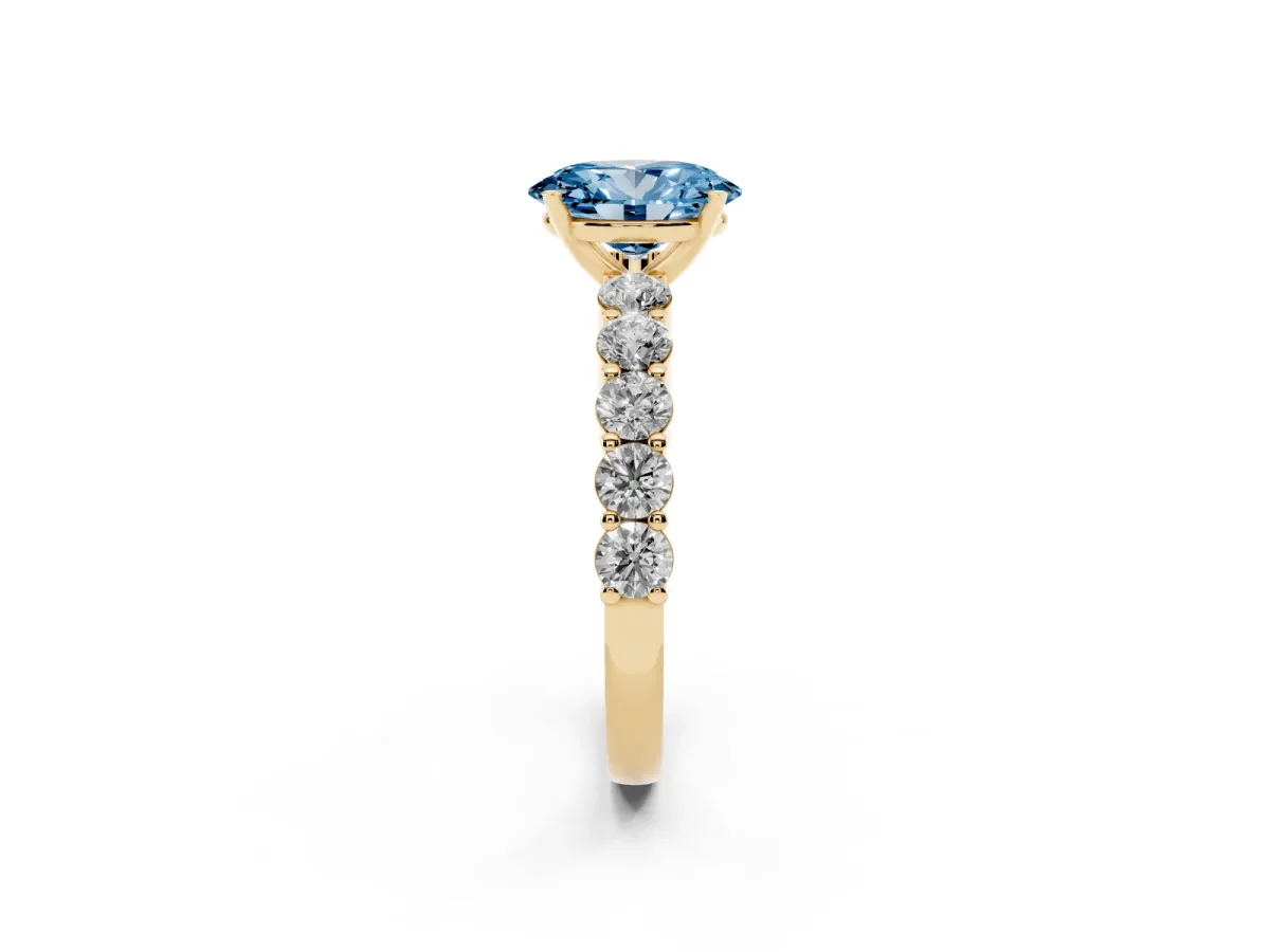 Fancy Blue Oval Cut Diamond Solitaire Ring with Shared Prong Round Side Stones Yellow gold