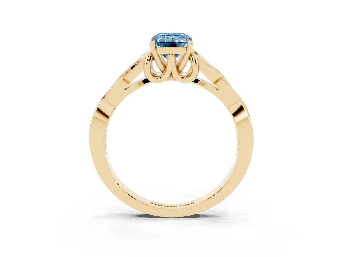 Fancy Blue Emerald Cut Diamond Solitaire Engagement Ring with Celtic Knot Band and Four-Prong Setting Yellow gold