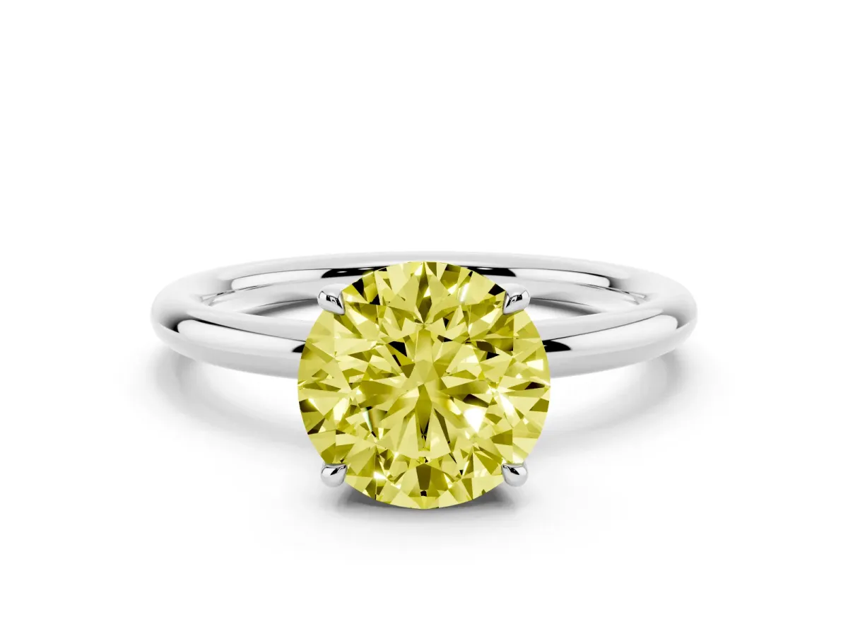Fancy Yellow Round Cut Diamond Solitaire Ring with Thin Band and Four-Prong Setting Platinum