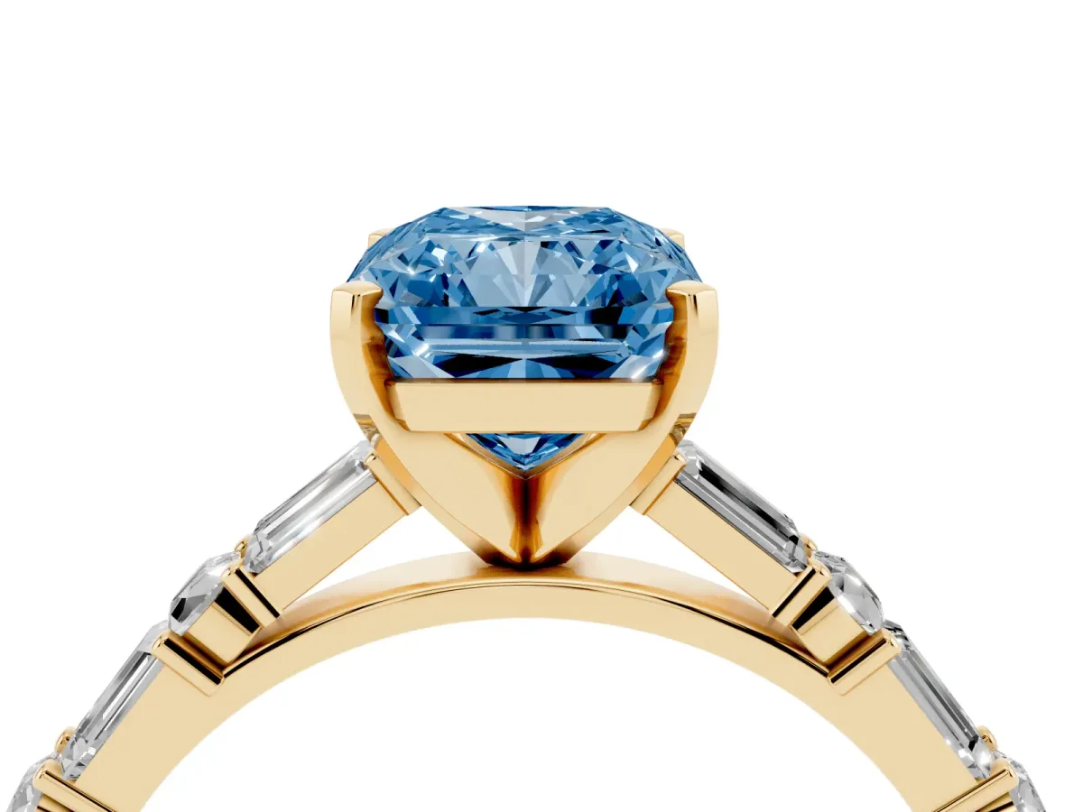 Fancy Blue Radiant Cut Diamond Solitaire with Side Baguettes and Channel Set Band Yellow gold