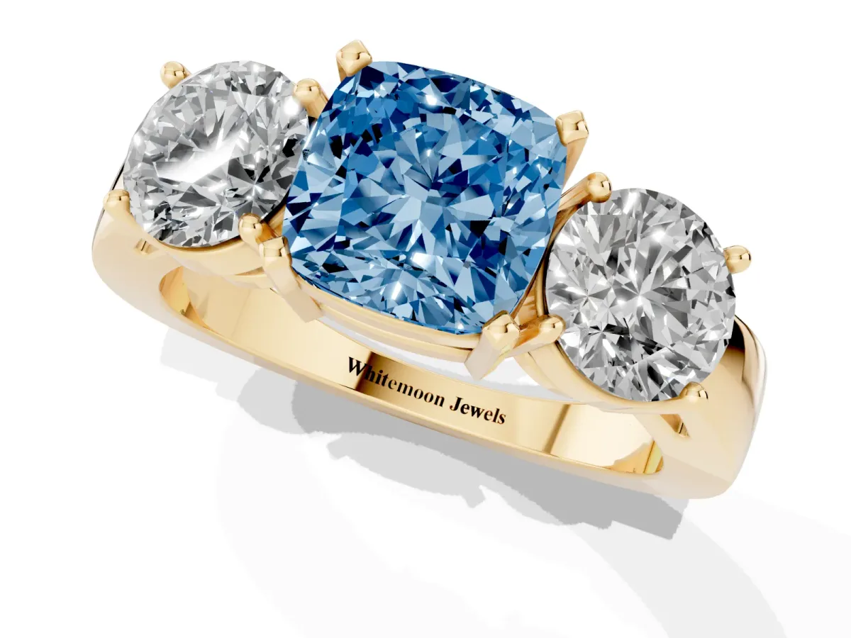 Fancy Blue Three-Stone Cushion Cut Diamond Ring with Round Side Stones, Classic Band, and Four-Prong Setting Yellow gold