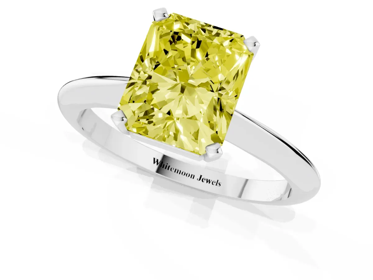 Fancy Yellow Radiant Cut Cut Solitaire Ring with Four-Prong Setting on a Classic Band Silver