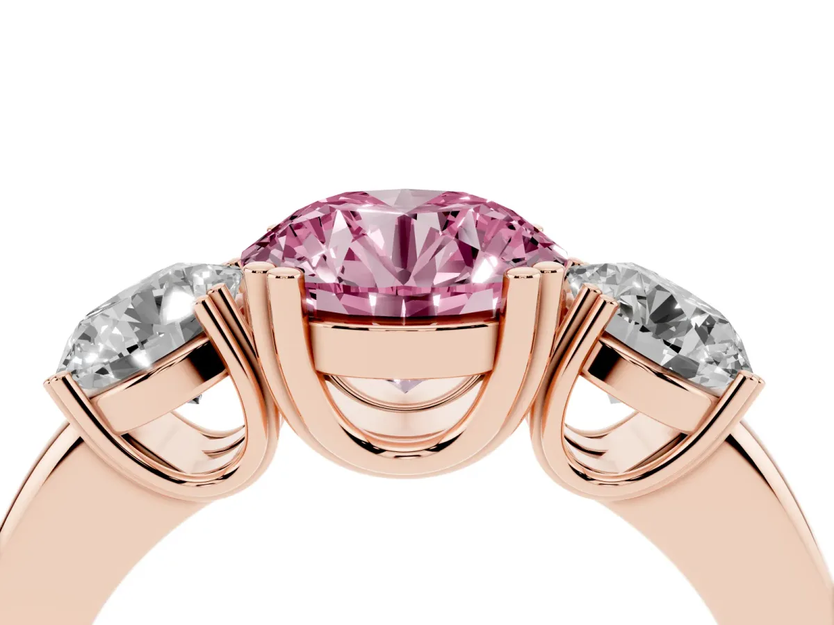 Fancy Pink Three-Stone Round Cut Cut Diamond Ring with Channel Set Band and Four-Prong Setting Rose gold