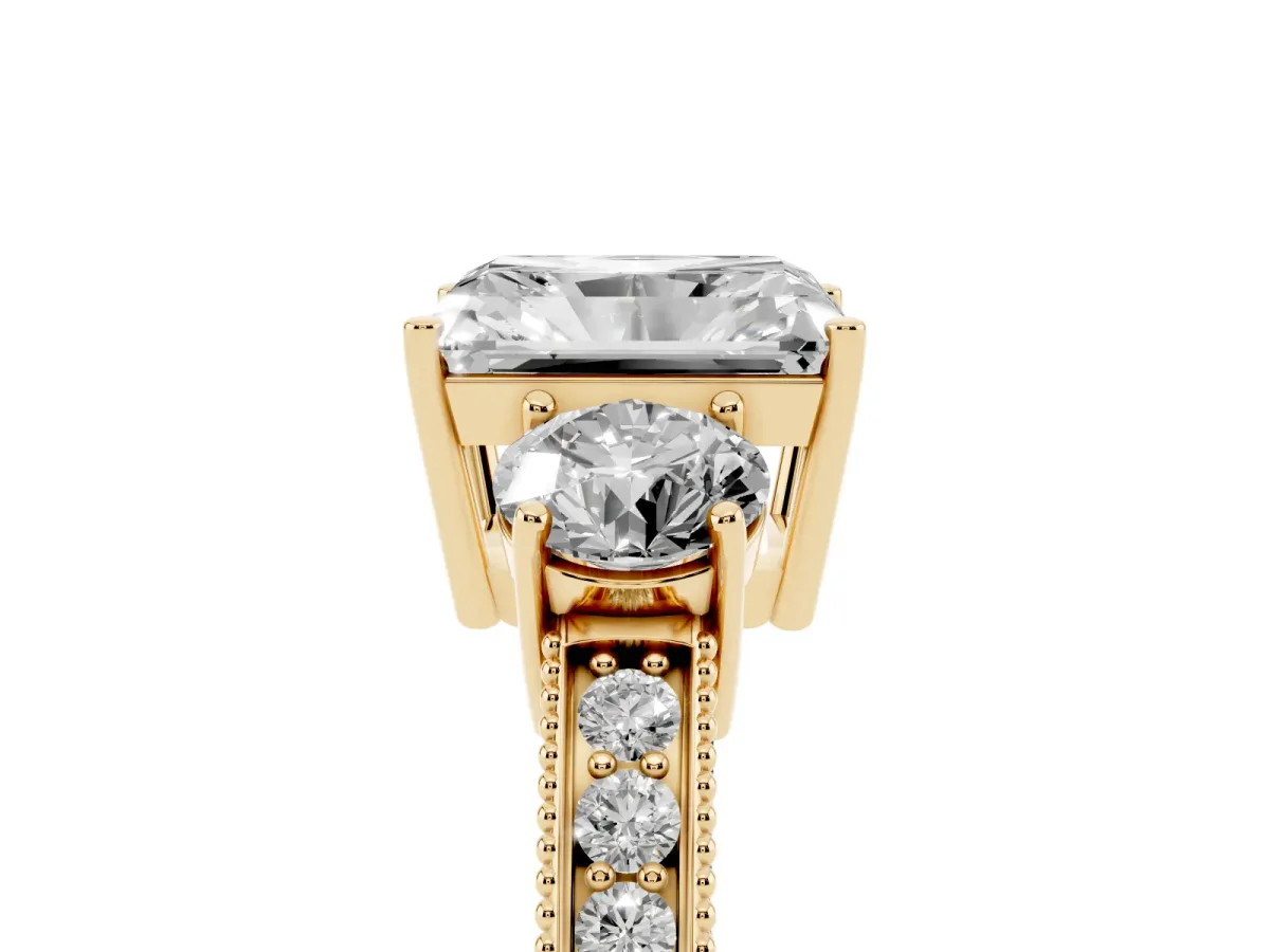 Radiant Cut Three-Stone Diamond Ring with Pavé Band and Four-Prong Setting Yellow gold