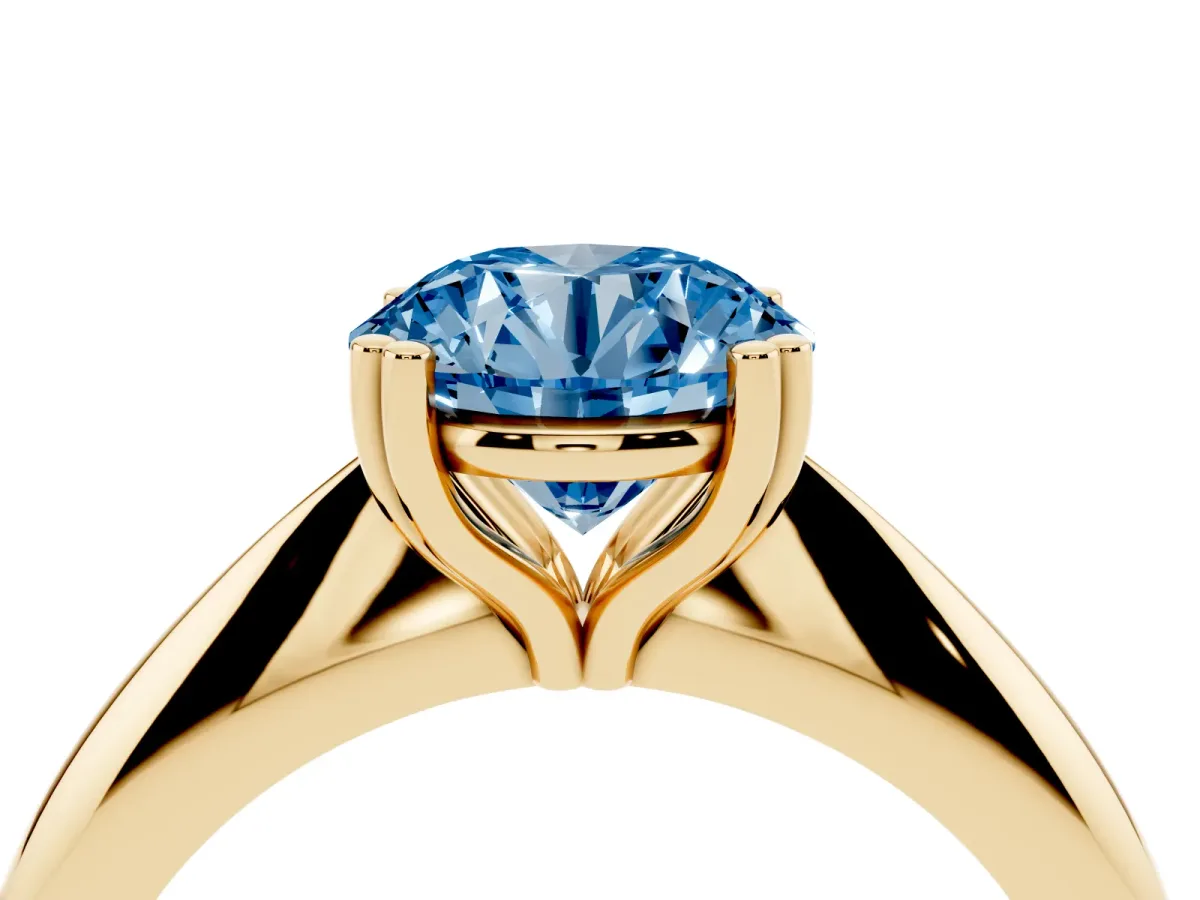 Fancy Blue Round Cut Cut Solitaire Engagement Ring with Tapered Band and Four-Prong Setting Yellow gold