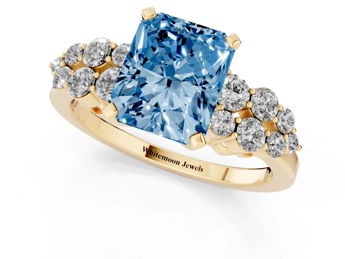 Fancy Blue Radiant Cut Cluster Diamond Engagement Ring with Pavé Band and Four-Prong Setting Yellow gold