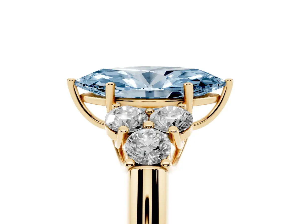 Fancy Blue Marquise Cut Cut Diamond Cluster Ring with Round Accent Stones and Prong Setting on a Classic Band Yellow gold