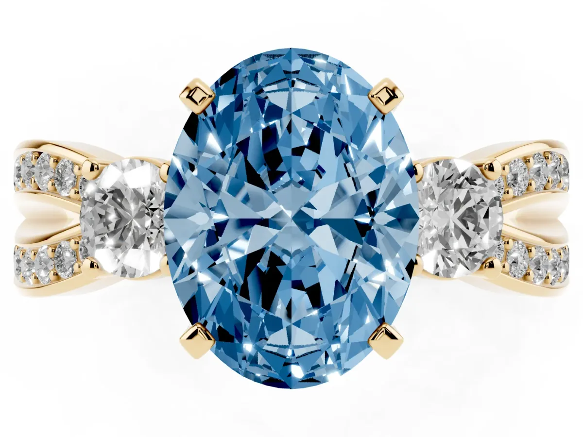 Fancy Blue Three-Stone Oval Cut Cut Diamond Twist Band with Prong Setting Yellow gold