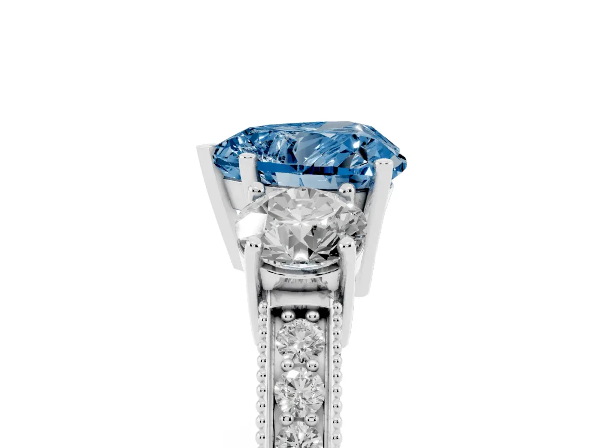 Fancy Blue Heart Cut Three-Stone Diamond Ring with Pavé Band and Four-Prong Setting Silver