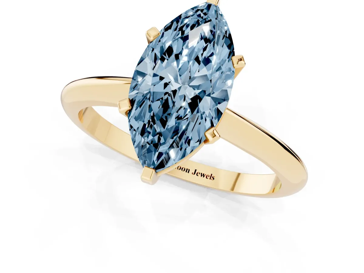 Fancy Blue Marquise Cut Cut Solitaire Ring with Four-Prong Setting on a Classic Band Yellow gold